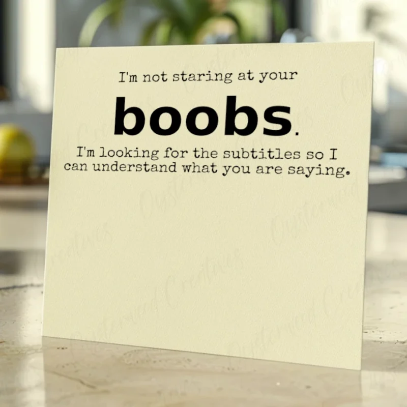 I'm not staring at your boobs. I'm looking for the subtitles so I can understand what you are saying. Mock up front of card.