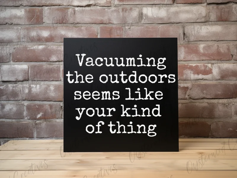 Vacuuming the outdoors seems like your kind of thing. Black sign with white lettering.