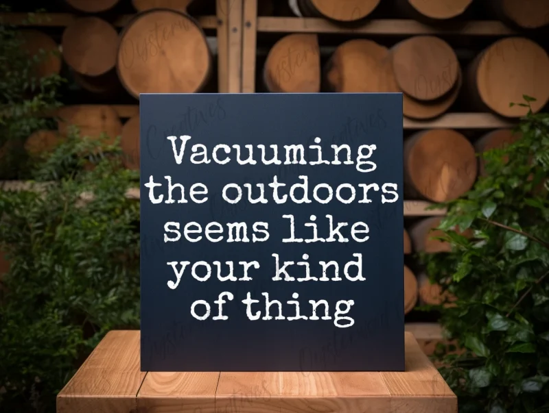 Vacuuming the outdoors seems like your kind of thing. Dark blue sign with white lettering.