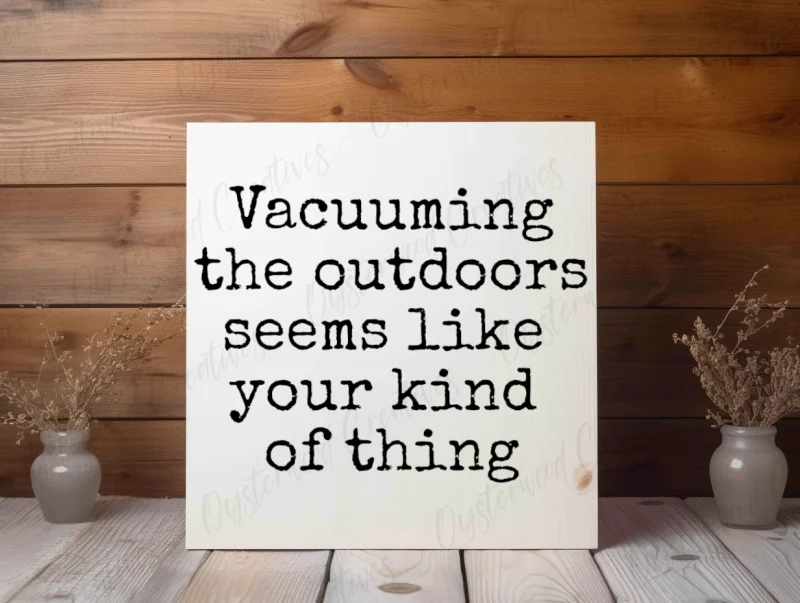 Vacuuming the outdoors seems like your kind of thing. White sign with black lettering.