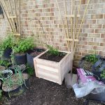 Completed prototype planter filled with soil.