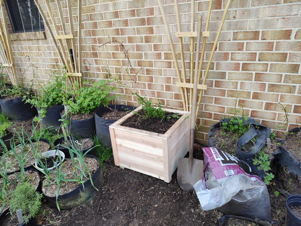 Completed prototype planter filled with soil.