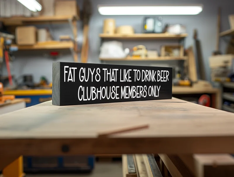 Fat guys that like to drink beer. Clubhouse members only. Black sign with white lettering.