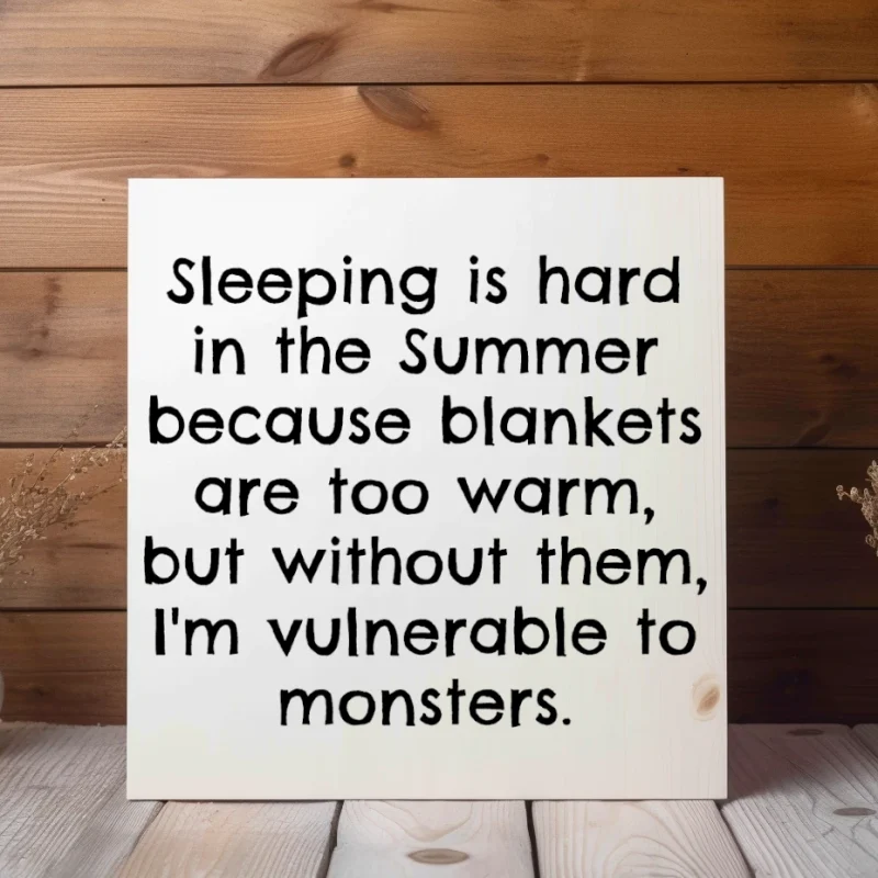 Sleeping is hard in the summer because blankets are too warm, but without them, I'm vulnerable to monsters. White sign with black lettering.