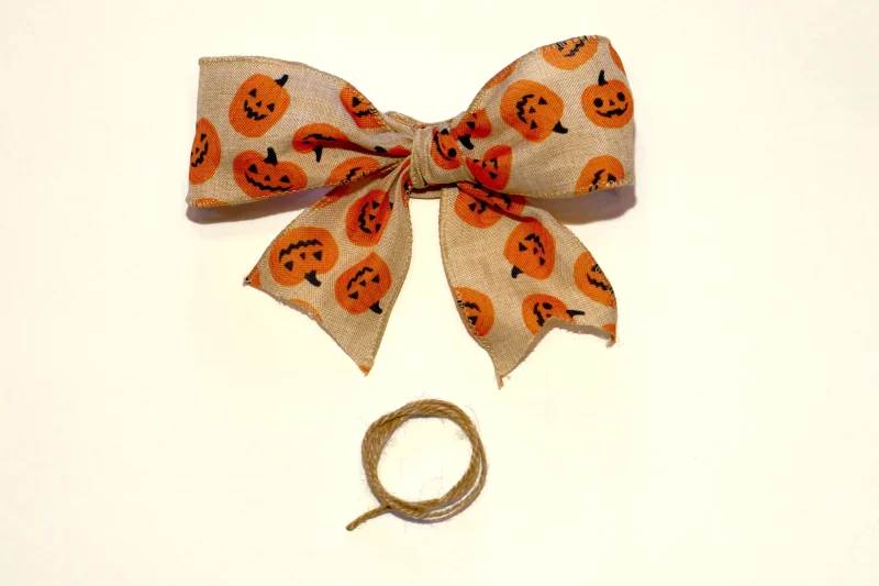 Halloween bow and twine for pumpkin sign.