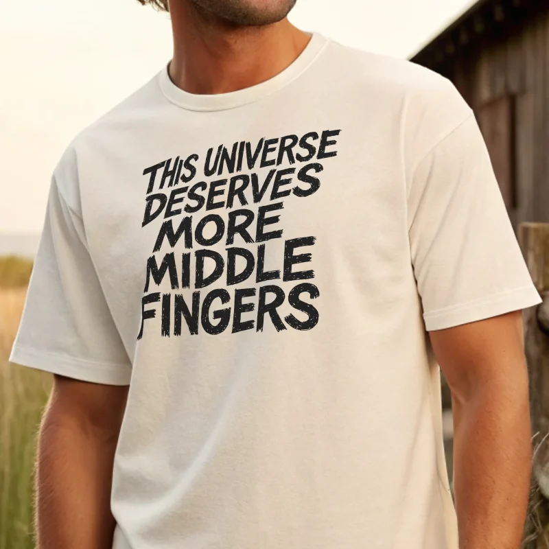The Universe Deserves more Middle Fingers. Male model full body pose. White t-shirt with black text. Closeup